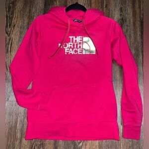 Women’s Small North Face pink hoodie with gold logo